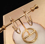 Load image into Gallery viewer, Aneka - 18K Gold Plated Designer Inspired Nail Swarovski Medium Hoops 2” drop
